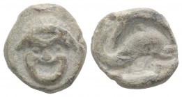 Roman PB Tessera, c. 1st century BC - 1st century AD (13mm, 3.56g, 2h). Theatrical mask. R/ Dolphin r. Good VF