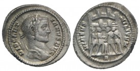Diocletian (284-305). AR Argenteus (20mm, 3.40g, 12h). Rome, c. AD 294. Laureate head r. R/ Four tetrarchs sacrificing over tripod before city enclosu...