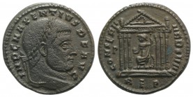 Maxentius (307-312). Æ Follis (24mm, 6.60g, 12h). Rome, 310-1. Laureate head r. R/ Roma seated facing, head l., within hexastyle temple, holding globe...