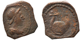 Uncertain. Circa 1-3rd century AD. Ae (bronze, 0.53 g, 11 mm). Helmeted bust of Athena right. Rev. Lyre. Nearly very fine.