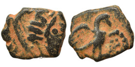 MESOPOTAMIA. Hatra. Pseudo-autonomous issue. Early-mid 2nd century AD. Ae (bronze, 1.88 g, 14 mm). Radiate head of sun god Shamash right. Rev. Eagle s...