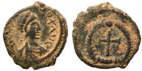Theodosius II, 402-450. Nummus (bronze, 1.25 g, 11 mm), Antioch (?). Pearl-diademed, draped and cuirassed bust right. Rev. Cross within wreath. Nearly...