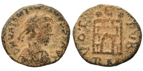 Valentinian III, 425-455. Nummus (bronze, 1.17 g, 13 mm), Rome. Pearl- diademed, draped and cuirassed bust to right. Rev. VOT [PVB] Camp-gate; RM in e...