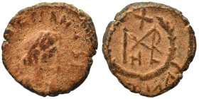 Marcian, 450-457. Nummus (bronze, 0.97 g, 10 mm). D N MARCIANVS P F AV Diademed, draped and cuirassed bust right. Rev. Monogram in wreath. Fine.