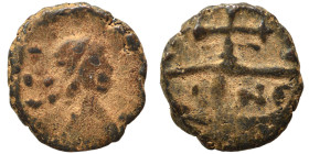 Barbaric imitation of Roman folles. Ae (bronze, 0.65 g, 9 mm). Diademed, draped and cuirassed bust right. Rev. Cross, mintmark below. Nearly very fine...