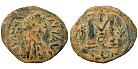 Anastasius I, 491-518. Follis (bronze, 13.76 g, 35 mm), Eastern imitation. Blundered legend; draped, and cuirassed bust right. Rev. Large M star to le...