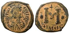 Justinian I, 527-565. Follis (bronze, 14.89 g, 32 mm), Theoupolis (Antioch). Pearl-diademed, draped, and cuirassed bust right. Rev. Large M; cross abo...