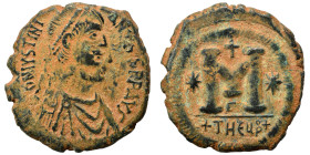Justinian I, 527-565. Follis (bronze, 15.86 g, 30 mm), Theoupolis (Antioch). Pearl-diademed, draped, and cuirassed bust right. Rev. Large M; cross abo...
