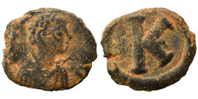 Justinian I, 527-565. Half follis (bronze, 3.13 g, 16 mm), Salona. Diademed, draped, and cuirassed bust right. Rev. Large K. DOC 360; MIBE 250; SB 331...