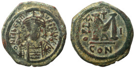 Maurice Tiberius, 582-602. Follis (bronze, 12.18 g, 29 mm). Constantinople. d N TIbЄR MAVR P P AVC Crowned and cuirassed bust facing, holding globus c...
