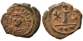 Maurice Tiberius, 582-602. Decanummium (bronze, 2.32 g, 16 mm), Constantinople. Helmeted, draped, and cuirassed bust facing. Rev. Large I between star...