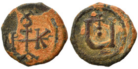 Maurice Tiberius, 582-602. Pentanummium (bronze, 1.55 g, 14 mm), Theoupolis (Antioch). Monogram. Rev. Large Ч; above, cross. DOC -. SB 539. Very fine....