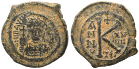 Maurice Tiberius, 582-602. Half Follis (bronze, 6.08 g, 24 mm). Thessalonica. D N mAVRC PP AVG helmeted and cuirassed facing bust, holding globus cruc...