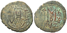 Maurice Tiberius, 582-602. Follis (bronze, 12.97 g, 34 mm), Cyzicus. O N [MVRICI] TIBЄR PP AV. Helmeted and cuirassed bust facing, holding globus cruc...