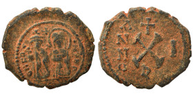 Phocas, with Leontia. 602-610. Decanummium (bronze, 3.10 g, 18 mm), Antioch. Phocas and Leontia standing facing, holding globus cruciger and cruciform...