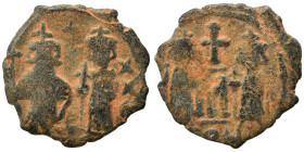 Constans II with Constantine IV, 641-668. Follis, 3.19 g, 20 mm). Constans II standing facing, with long beard, crowned and in military dress, holding...