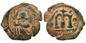 Arab Byzantine. Umayyad Caliphate, circa 641-660 AD. Fals (bronze, 3.15 g, 22 mm). Pseudo-Byzantine type, imitating the types of Constans II. Standing...