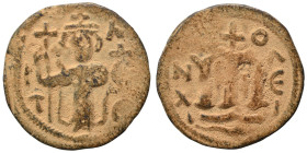 Arab Byzantine. Umayyad Caliphate, circa 641-660 AD. Fals (bronze, 3.09 g, 21 mm). Pseudo-Byzantine type, imitating the types of Constans II. Standing...