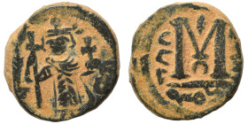 Arab Byzantine. Umayyad Caliphate, circa 641-660 AD. Fals (bronze, 5.22 g, 17 mm). Pseudo-Byzantine type, imitating the types of Constans II. Standing...
