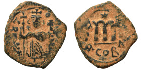 Arab Byzantine. Umayyad Caliphate, circa 641-660 AD. Fals (bronze, 5.49 g, 26 mm). Pseudo-Byzantine type, imitating the types of Constans II. Standing...