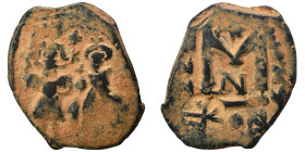 Arab-Byzantine. Umayyad Caliphate, circa 641-660 AD. Fals (bronze, 5.52 g, 26 mm). Two imperial standing figures, each holding cruciform sceptre. Rev....