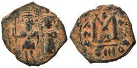 Arab-Byzantine. Umayyad Caliphate, circa 641-660 AD. Fals (bronze, 3.47 g, 24 mm). Two imperial standing figures, each holding cruciform sceptre. Rev....