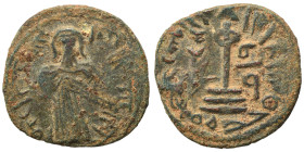 Arab Byzantine. Umayyad Caliphate. al-Malik ibn Marwan, AH 65-86 / 685-705 AD. Fals (bronze, 3.40 g, 20 mm), 'Standing Caliph' type. Caliph standing f...