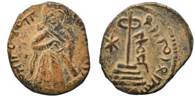 Arab Byzantine. Umayyad Caliphate. al-Malik ibn Marwan, AH 65-86 / 685-705 AD. Fals (bronze, 1.70 g, 18 mm), 'Standing Caliph' type. Caliph standing f...