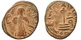 Arab Byzantine. Umayyad Caliphate. al-Malik ibn Marwan, AH 65-86 / 685-705 AD. Fals (bronze, 2.99 g, 21 mm), 'Standing Caliph' type. Caliph standing f...