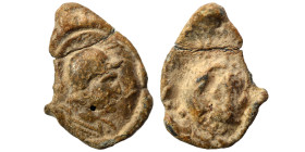 Greek-Roman. Seal (lead, 3.24 g, 20 mm). Helmeted head right. Rev. Head right. Nearly very fine.
