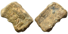 Greek-Roman. Tesserae (lead, 6.22 g, 18x12 mm). Male bust left, legend around. Rev. Uncertain. Good fine.