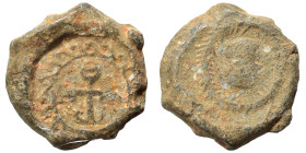 Roman. Seal (lead, 7.29 g, 19 mm). Facing head (?) within wreath. Rev. Monogram. Good fine.