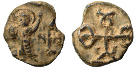 Byzantine seal (lead, 5.03 g, 17 mm). Nimbate figure standing, facing, raising his left arm; monogram to right. Rev. Monogram. Nearly very fine.