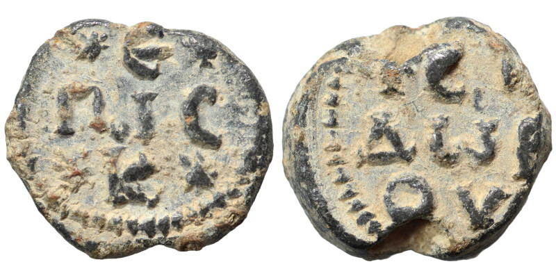 Byzantine seal (lead, 6.17 g, 18 mm). Legend in three lines. Rev. Legend in thre...