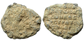 Byzantine seal (lead, 11.83 g, 25 mm). Bust of saint facing. Rev. Legend in six lines. Fine.