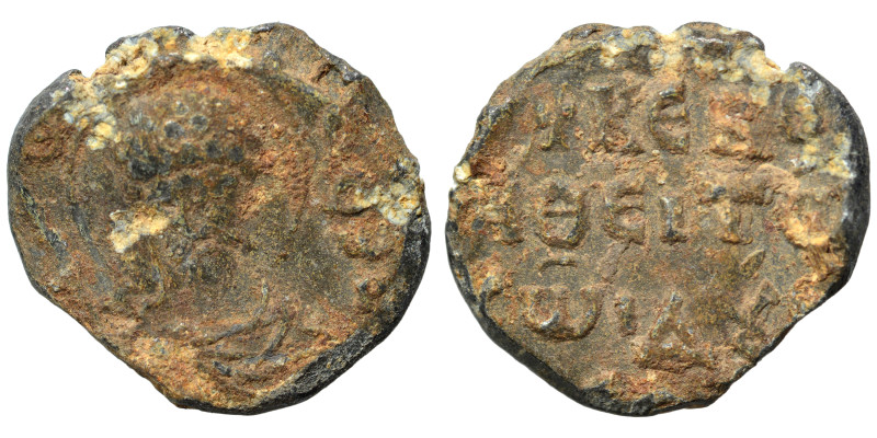 Byzantine seal (lead, 6.54 g, 21 mm). Bust of saint facing. Rev. Legend in three...