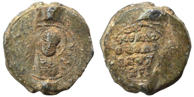 Byzantine seal (lead, 6.47 g, 19 mm). Nimbate saint facing. Rev. Legend in four ...