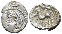 Central Gaul. Bituriges Cubi, c. 70-50 BC. Quinarius AR (16mm, 1.93g, 9h). Celticized male head with thick locks to left. R/ Celticized horse prancing...