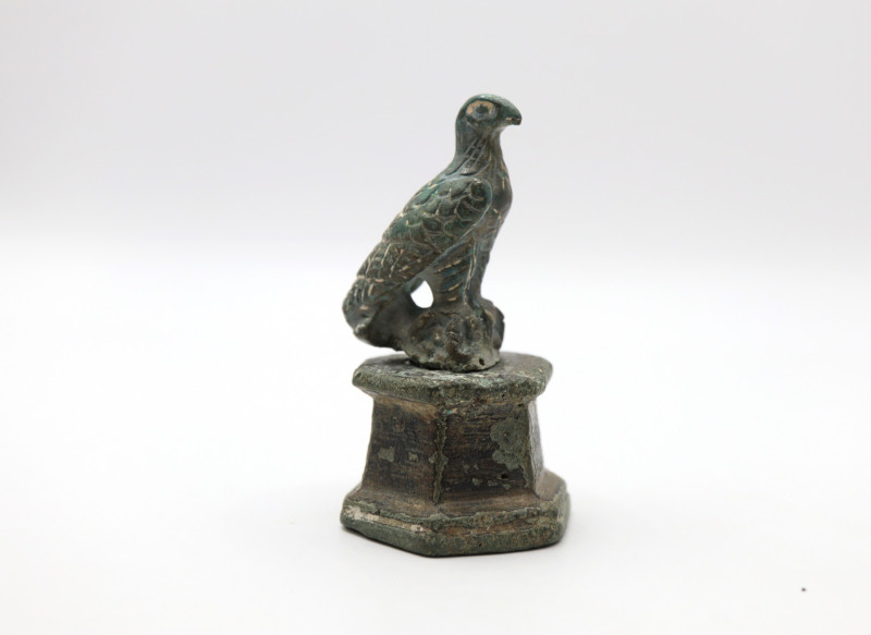 Roman Figurine of Eagle Over a Bull Head 
2nd ,3rd Century AD
A bronze figurine...