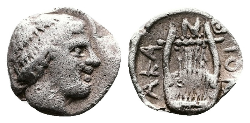 Macedon, Akanthos. Circa 390 BC. AR Obol (9mm, 0.30 g.). Laureate head of Apollo...