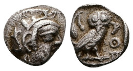 Attica, Athens. Circa 454-404 BC. AR Obol (9mm, 0,65 g.). Head of Athena to right, wearing earring, necklace, and crested Attic helmet decorated with ...