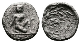 Peloponnesos. Sikyonia, Sikyon. Circa 400-350 BC. AR Tritartemorion or ¾ obol (10mm, 0.47 g.). Archaic figure of Apollo kneeling to right, holding bow...