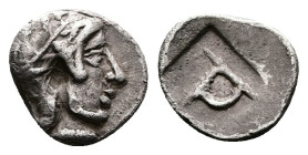 Ionia, Kolophon. Circa 450-410 BC. AR Tetartemorion (8 mm, 0.32 g.). Head of Apollo to right wearing a laurel wreath on his helmet with a neck and che...