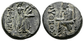 Ionia, Kolophon. Circa 50 BC. AE (17 mm, 6,21 g.). Pytheos, magistrate. ΠYΘEOΣ The Poet Homer seated left, holding scroll in his left hand and proppin...