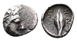 Ionia, Magnesia ad Maeandrum. Circa 400-350 BC. AR Tetartemorion (6 mm, 0.19 g.). Youthful male head of Apollo to right. Rev. [MA]ΓΝΗ (retrograde) Bar...