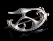 A ROMAN SILVER OPENWORK TRUMPET BROOCH WITH DUCK HEAD Circa 2nd-3rd century AD. Fine plate brooch with a complex Celtic trumpet-style design featuring...