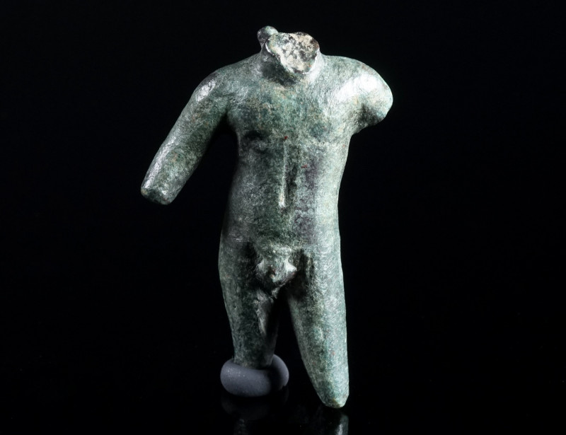 A ROMAN BRONZE TORSO OF APOLLO Circa 1st-3rd century AD. Small bronze statuette,...