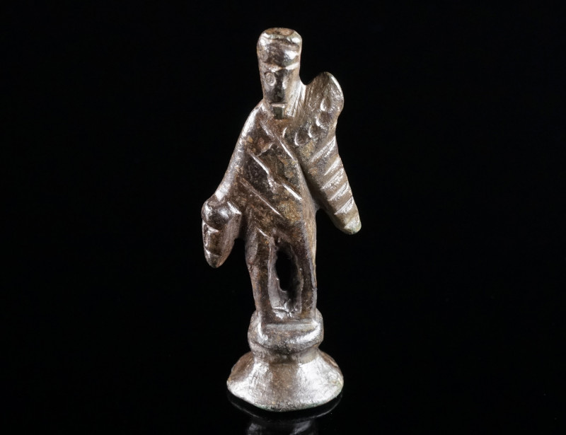 A ROMAN BRONZE STATUETTE OF MERCURY Circa 2nd-3rd century AD. A stylised represe...