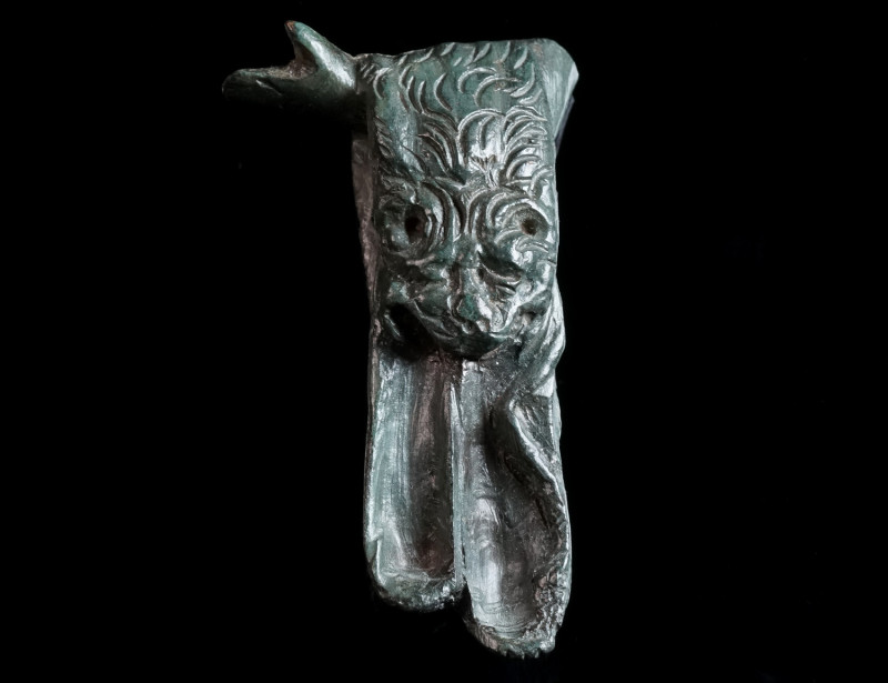 A ROMAN BRONZE LEFT ARM WITH LION SKIN Circa 1st-3rd century AD. Outstretched le...