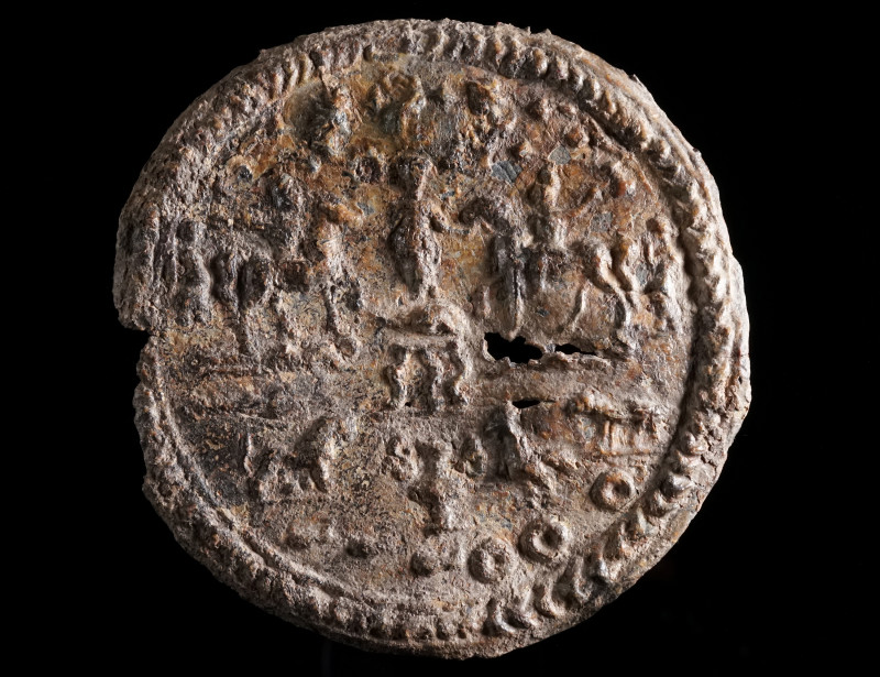 A RARE ROMAN DANUBIAN RIDER LEAD VOTIVE PLAQUE Circa 3rd-4th century AD. Circula...